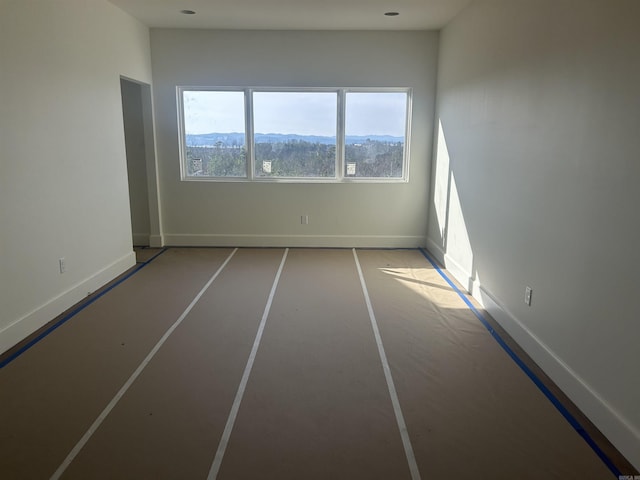 spare room featuring a mountain view