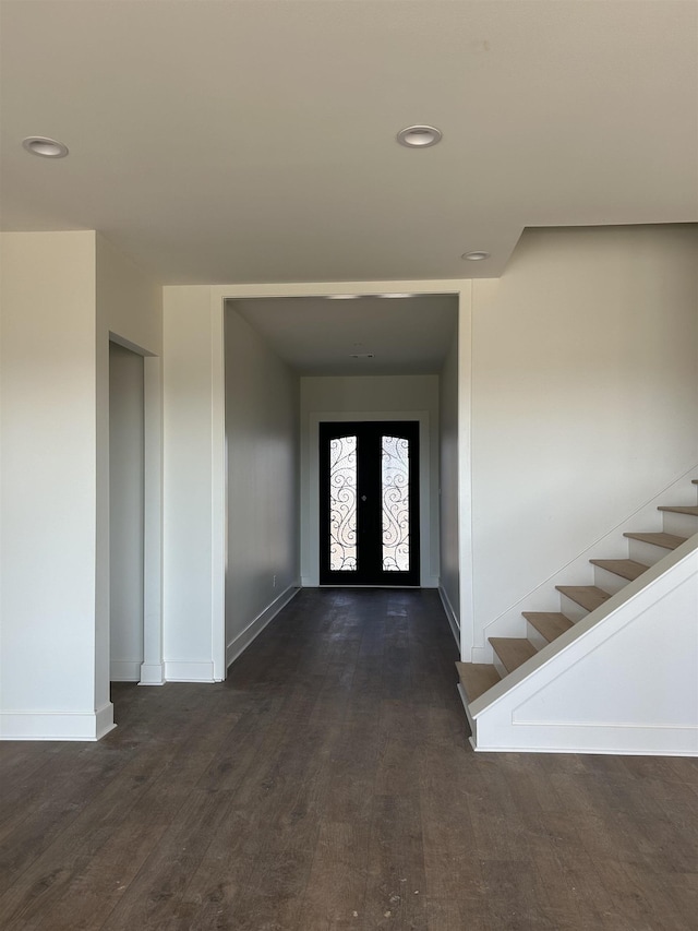 foyer entrance with dark hardwood / wood-style flooring and french doors