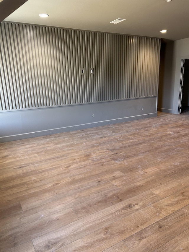 spare room featuring light hardwood / wood-style flooring