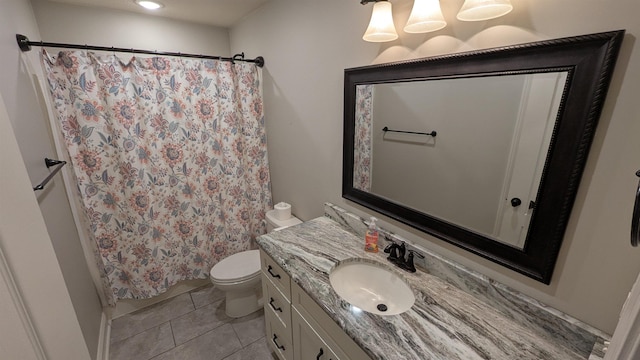 bathroom featuring walk in shower, tile patterned floors, vanity, and toilet