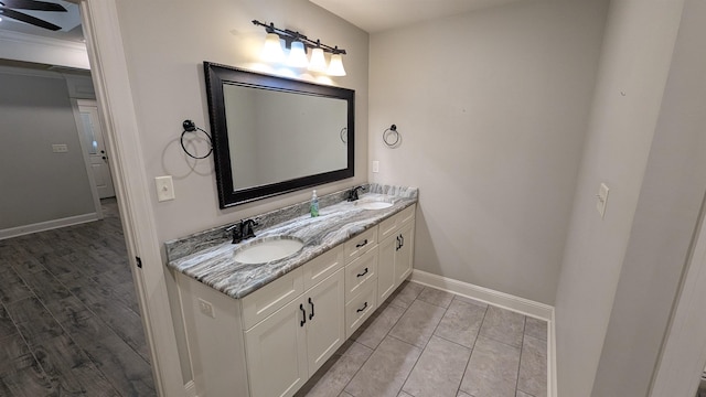 bathroom featuring vanity, hardwood / wood-style floors, and ceiling fan