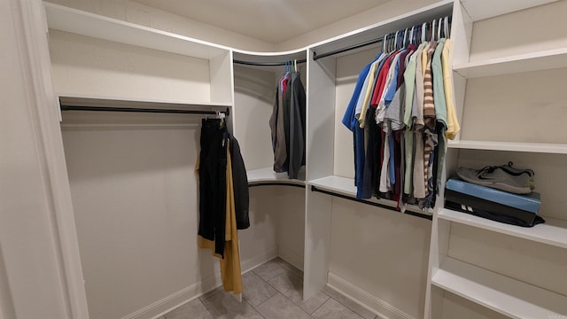 spacious closet with light tile patterned flooring