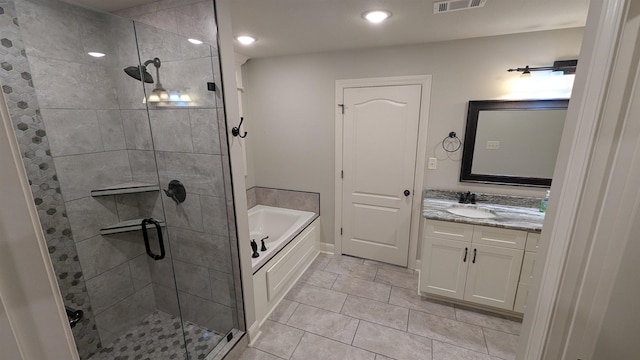 bathroom with vanity, independent shower and bath, and tile patterned flooring