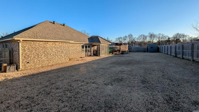 view of side of property with a shed