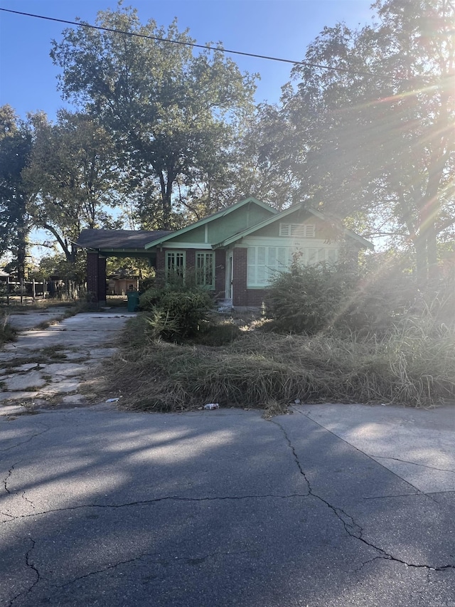 view of home's exterior with a carport