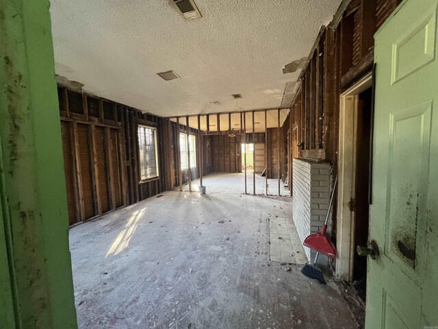 miscellaneous room featuring a textured ceiling