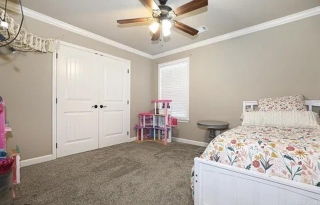 bedroom featuring carpet, a closet, ceiling fan, and ornamental molding