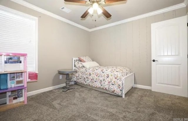 bedroom with carpet, ceiling fan, and crown molding