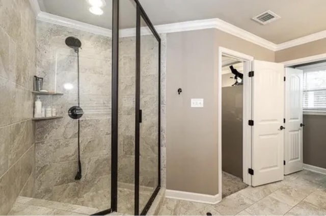 bathroom featuring a tile shower and crown molding