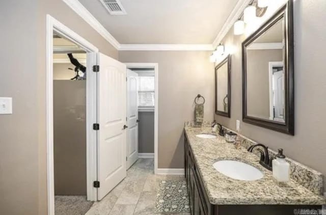 bathroom featuring vanity and ornamental molding