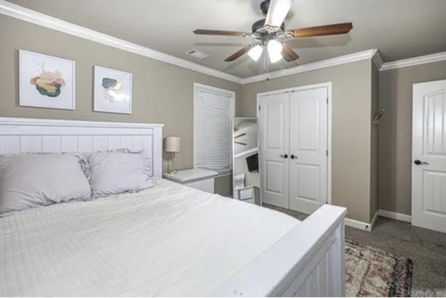 carpeted bedroom with ceiling fan, a closet, and ornamental molding