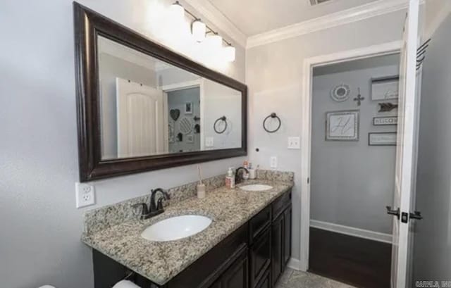 bathroom featuring vanity and crown molding