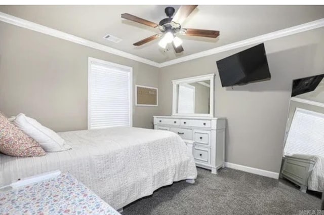 carpeted bedroom with multiple windows, ceiling fan, and crown molding