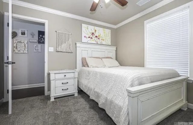 carpeted bedroom with ceiling fan and crown molding