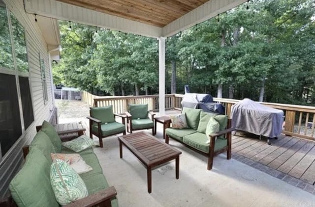 view of patio / terrace with a grill, a deck, and an outdoor hangout area