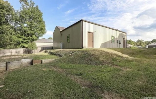 view of outbuilding with a yard