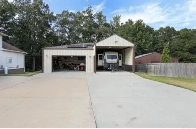 view of front of house with solar panels and a garage