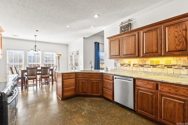 kitchen with pendant lighting, backsplash, sink, a textured ceiling, and stainless steel appliances