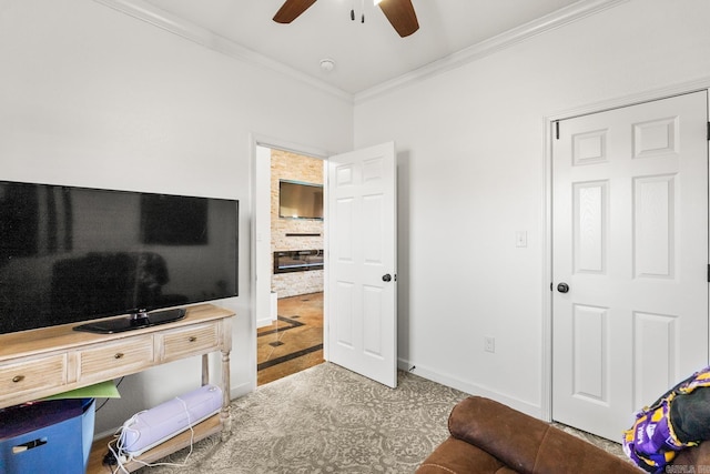 living room featuring crown molding and ceiling fan