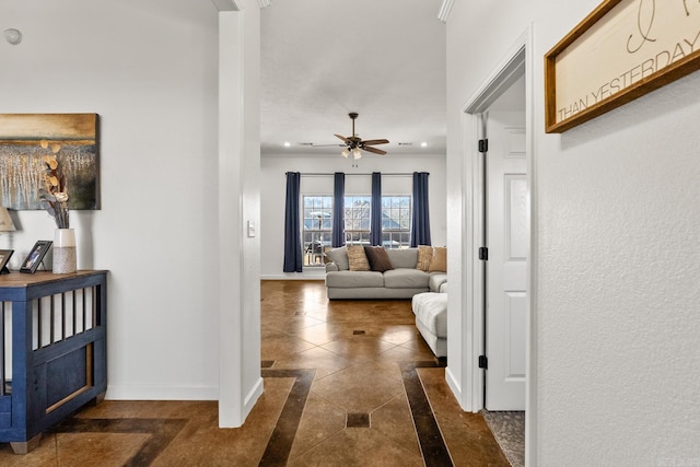 hall with dark tile patterned floors