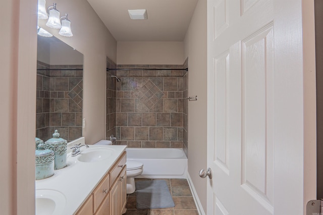 full bathroom featuring toilet, vanity, and tiled shower / bath