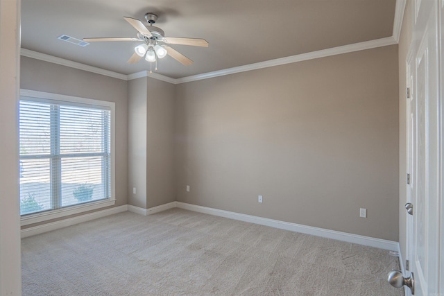 empty room with ceiling fan, ornamental molding, and light carpet