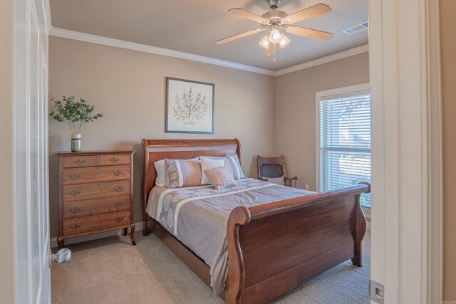 bedroom with ceiling fan, light colored carpet, and ornamental molding