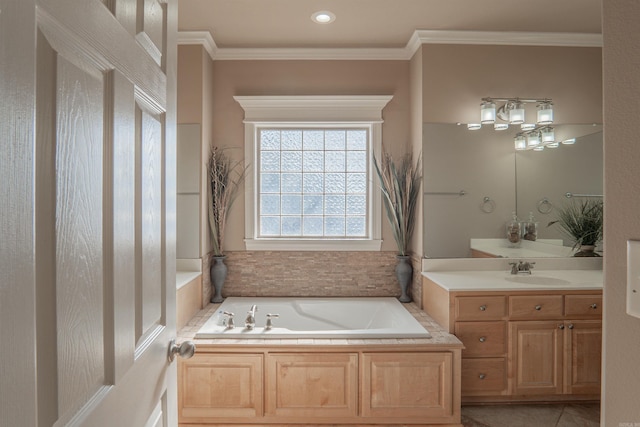 bathroom featuring tile patterned flooring, a washtub, vanity, and ornamental molding