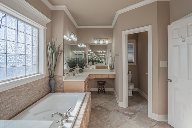 bathroom featuring ornamental molding, a relaxing tiled tub, a healthy amount of sunlight, and toilet