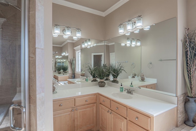 bathroom featuring a shower with door, vanity, and ornamental molding