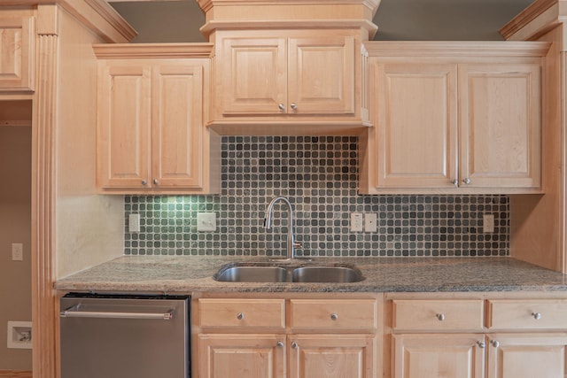 kitchen with dishwasher, backsplash, sink, light brown cabinetry, and light stone counters