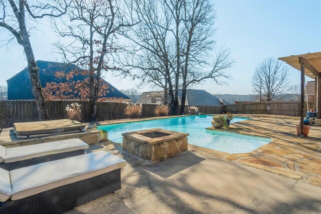 view of swimming pool with a mountain view, a patio area, a jacuzzi, and an outdoor fire pit