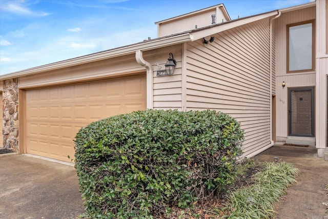 exterior space with a garage and driveway