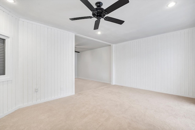 empty room with light carpet and ceiling fan