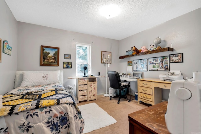 bedroom with a textured ceiling and light colored carpet