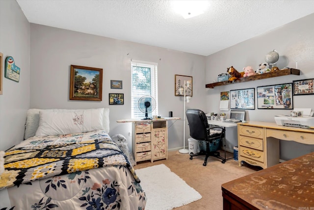 bedroom with a textured ceiling and light colored carpet