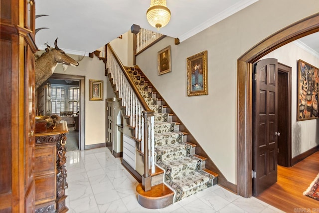 staircase featuring ornamental molding