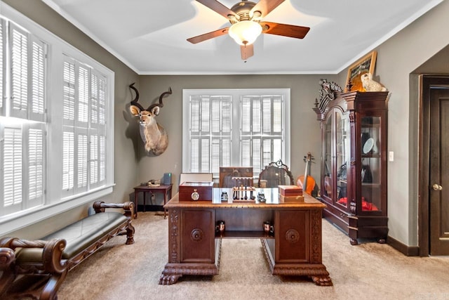 office area featuring light carpet, crown molding, and ceiling fan