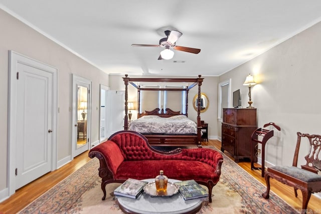 bedroom with light hardwood / wood-style floors and ceiling fan