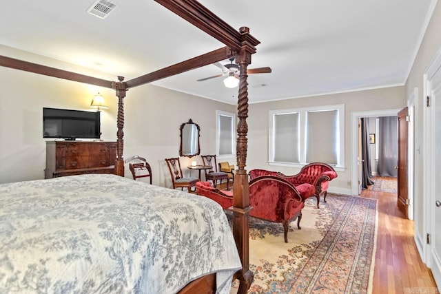 bedroom with ceiling fan, light hardwood / wood-style flooring, and ornamental molding