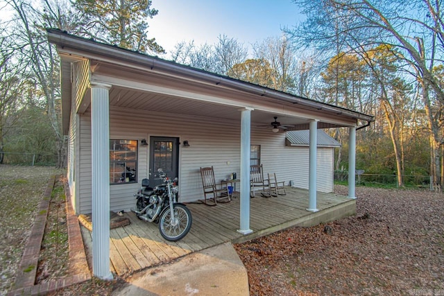 rear view of house featuring covered porch and ceiling fan