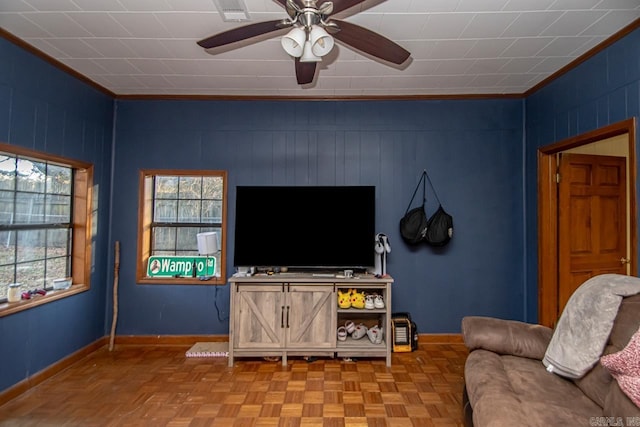 living room featuring crown molding and light parquet flooring