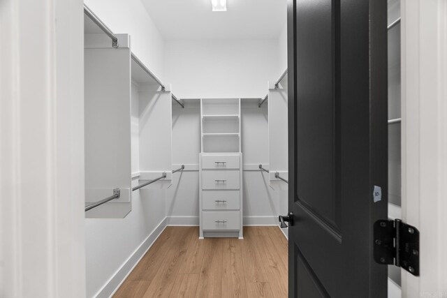 walk in closet featuring light wood-type flooring