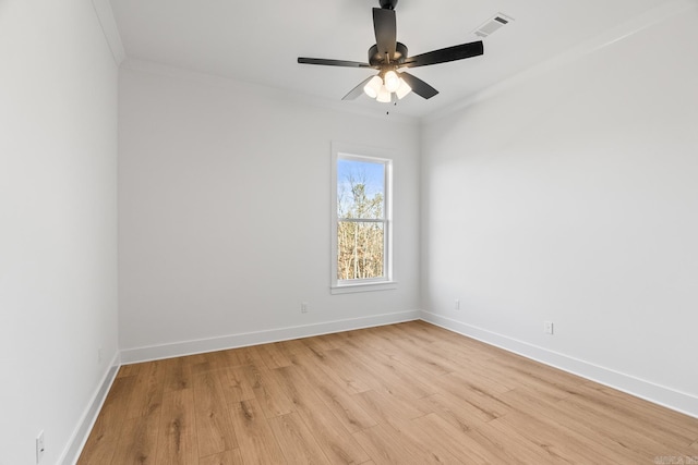 unfurnished room featuring light hardwood / wood-style flooring, ceiling fan, and crown molding