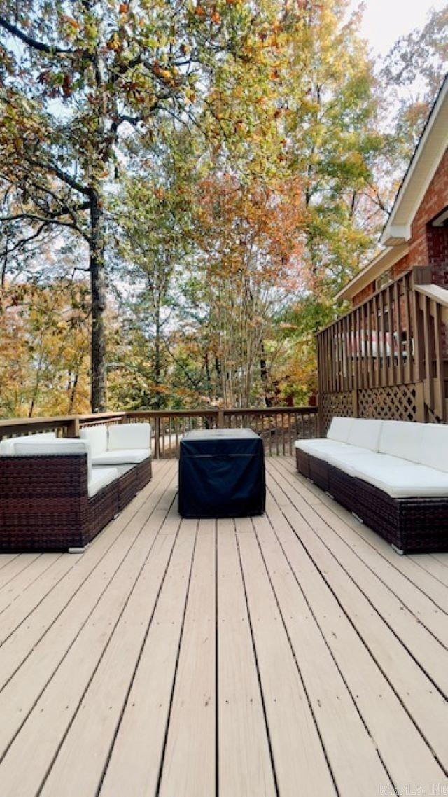 wooden deck with an outdoor hangout area