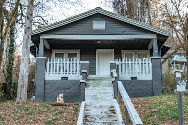 bungalow-style house featuring covered porch