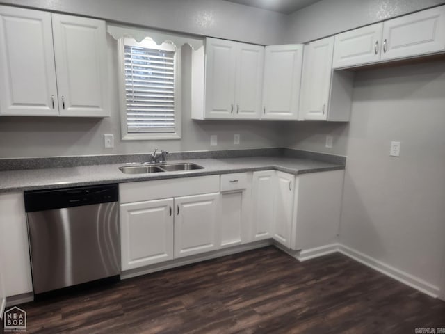 kitchen with stainless steel dishwasher, white cabinets, and sink