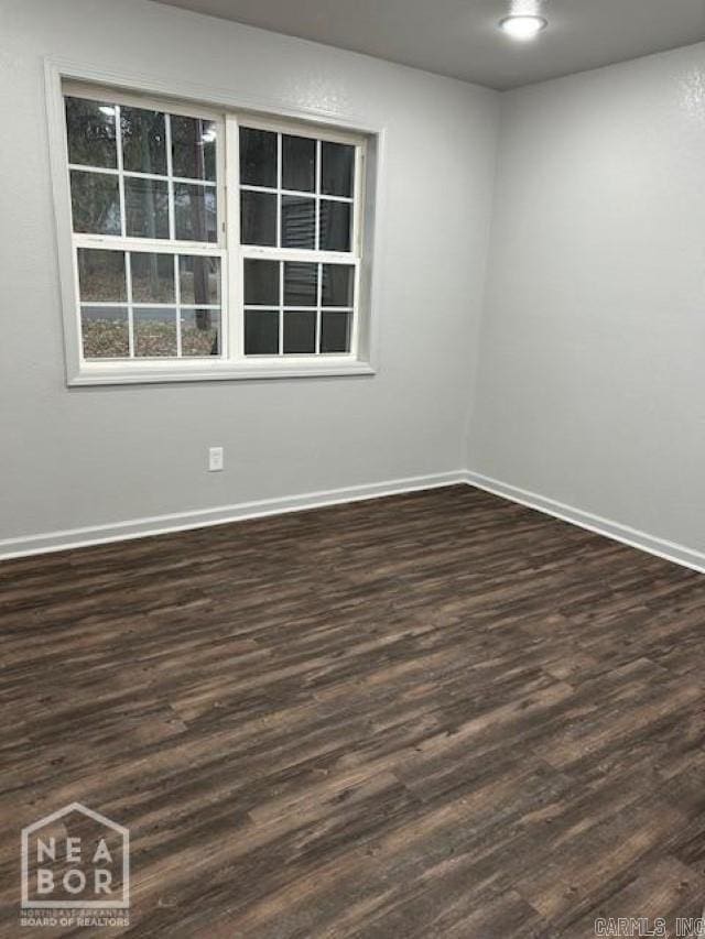 empty room featuring dark hardwood / wood-style floors