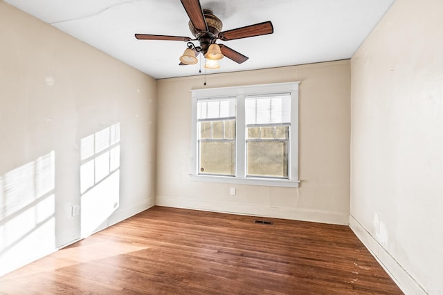 unfurnished room featuring ceiling fan and hardwood / wood-style flooring