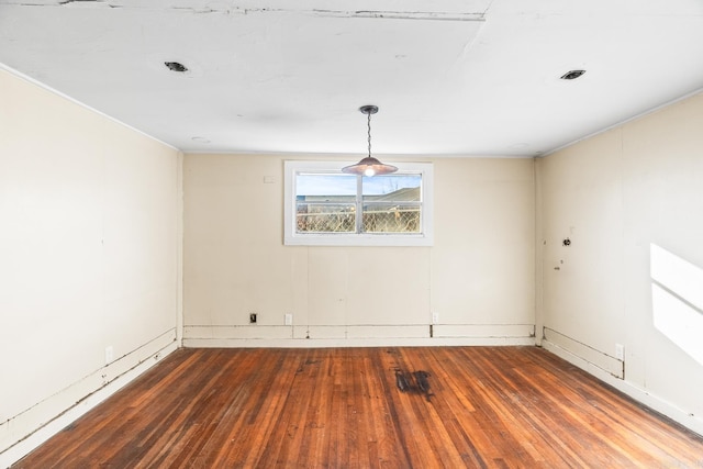 empty room featuring dark hardwood / wood-style flooring